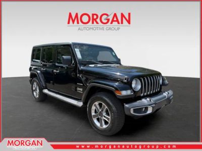 2021 Jeep Wrangler Unlimited Sahara in Black — front three-quarter view