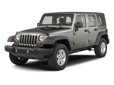 2013 Jeep Wrangler Unlimited Sport in Commando Green — front three-quarter view