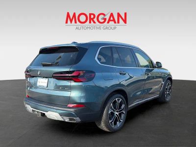 2026 BMW X5 — rear three-quarter view