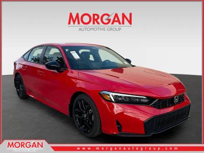 2026 Honda Civic Sedan Sport in Rallye Red — front three-quarter view