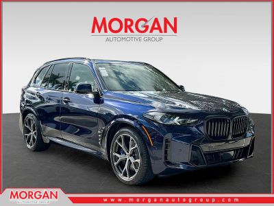 2026 BMW X5 xDrive50e in Tanzanite Blue II Metallic — front three-quarter view