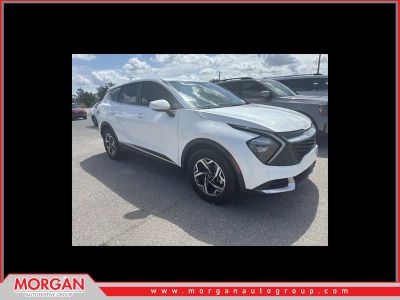 2023 Kia Sportage LX in Snow White Pearl — front three-quarter view