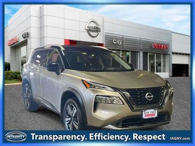 2023 Nissan Rogue SL in Champagne Silver Metallic/Super Black — front three-quarter view