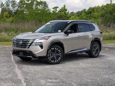 2024 Nissan Rogue Platinum in Gold — front three-quarter view