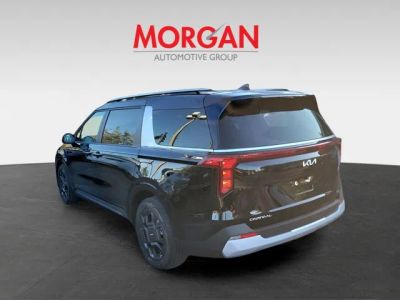 2026 Kia Carnival Hybrid — rear three-quarter view