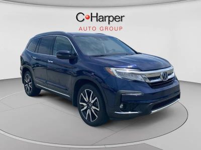 2022 Honda Pilot Elite in Obsidian Blue Pearl — front three-quarter view