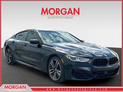 2023 BMW 8 Series 840i in Black Sapphire Metallic — front three-quarter view