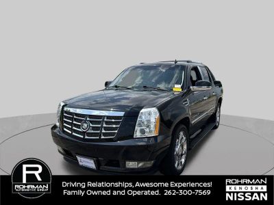 2011 Cadillac Escalade EXT Premium in Black Raven — front three-quarter view