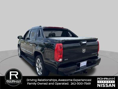 2011 Cadillac Escalade EXT — rear three-quarter view