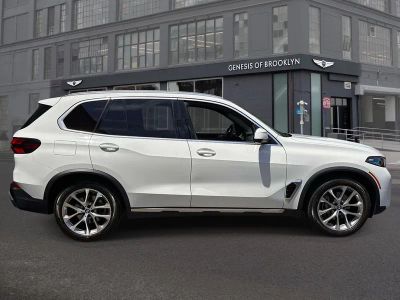 2024 BMW X5 — rear three-quarter view