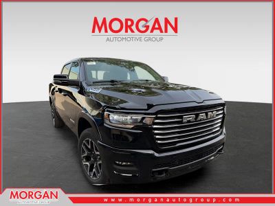2026 Ram 1500 Laramie in Diamond Black Crystal Pearlcoat — front three-quarter view