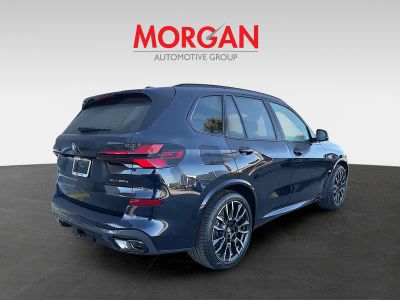 2026 BMW X5 — rear three-quarter view