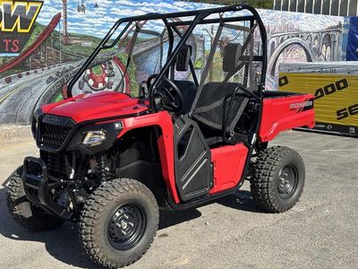 2025 Honda Pioneer 520 in HERO RED — front three-quarter view