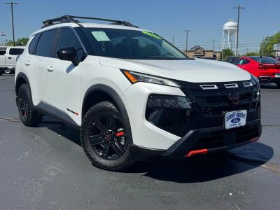 2025 Nissan Rogue Rock Creek in Everest White Pearl — front three-quarter view