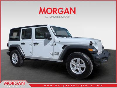 2018 Jeep Wrangler Unlimited Sport S in White — front three-quarter view