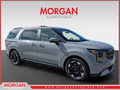 2026 Kia Carnival EX in Ceramic Silver — front three-quarter view