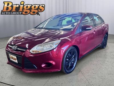 2013 Ford Focus SE in Ruby Red Metallic Tinted Clear Coat — front three-quarter view