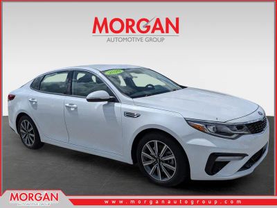 2020 Kia Optima EX in Snow White Pearl — front three-quarter view