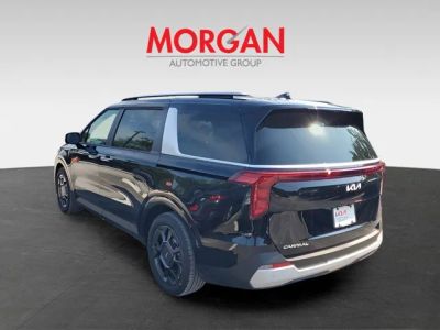 2026 Kia Carnival Hybrid — rear three-quarter view