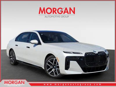 2025 BMW 7 Series 740i in Mineral White Metallic — front three-quarter view