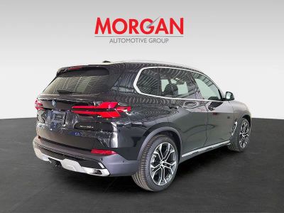 2026 BMW X5 — rear three-quarter view