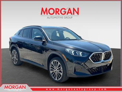2026 BMW X2 xDrive28i in Black Sapphire Metallic — front three-quarter view