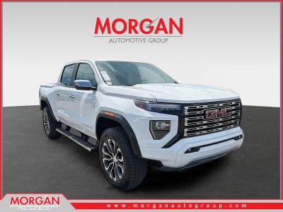 2023 GMC Canyon Denali in White — front three-quarter view
