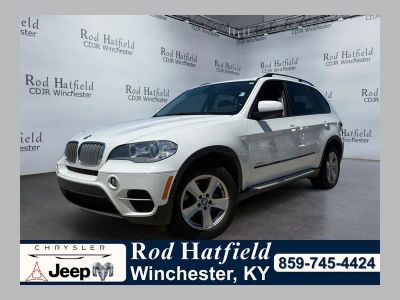 2012 BMW X5 xDrive35d in Alpine White — front three-quarter view