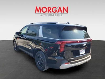 2026 Kia Carnival Hybrid — rear three-quarter view