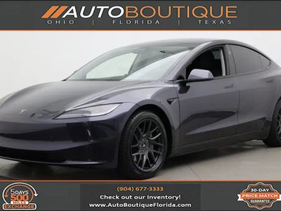2024 Tesla Model 3 Long Range in Solid Black — front three-quarter view