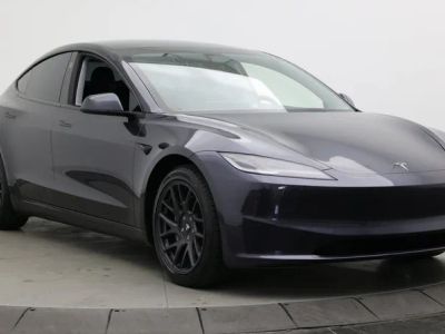 2024 Tesla Model 3 — rear three-quarter view