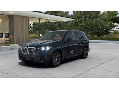 2026 BMW X5 xDrive40i in Carbon Black Metallic — front three-quarter view
