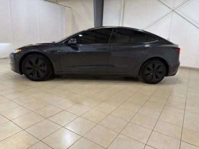 2025 Tesla Model 3 — rear three-quarter view