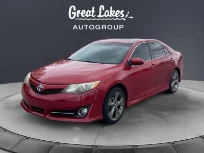 2012 Toyota CAMRY SE in Barcelona Red Metallic — front three-quarter view