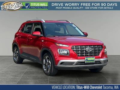 2025 Hyundai Venue SEL in Red — front three-quarter view