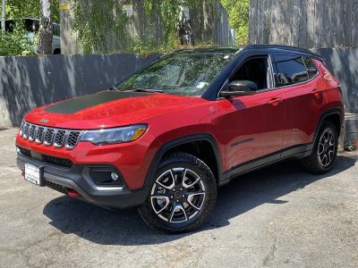 2025 Jeep Compass Trailhawk in Red/Red — front three-quarter view