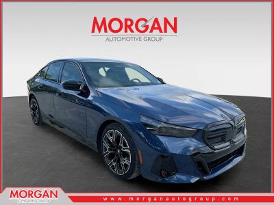2024 BMW i5 M60 in Phytonic Blue Metallic — front three-quarter view