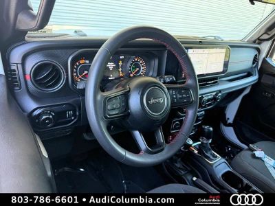 2024 Jeep Wrangler — rear three-quarter view