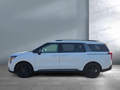 2025 Kia Carnival — rear three-quarter view
