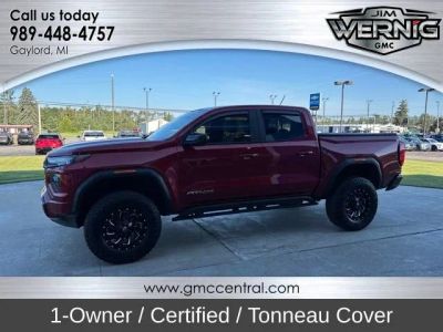 2024 GMC Canyon AT4X in Volcanic Red Tintcoat — front three-quarter view