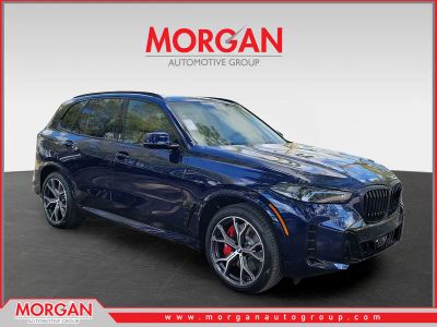 2026 BMW X5 xDrive50e in Tanzanite Blue II Metallic — front three-quarter view