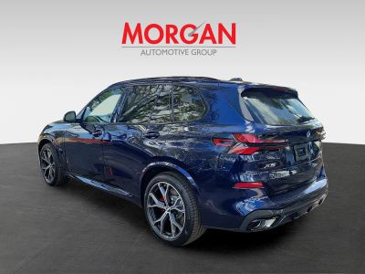 2026 BMW X5 — rear three-quarter view