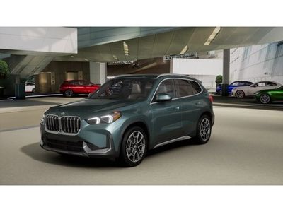 2026 BMW X1 xDrive28i in Cape York Green Metallic — front three-quarter view