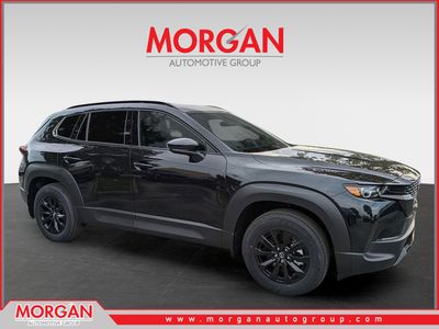 2026 Mazda CX-50 Hybrid Premium in Jet Black Mica — front three-quarter view