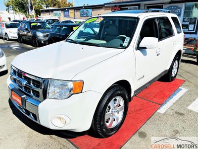 2009 Ford Escape Hybrid in White — front three-quarter view