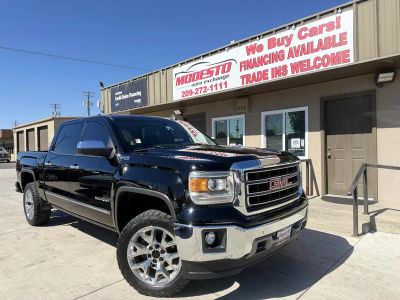 2015 GMC Sierra 1500 in Black — front three-quarter view