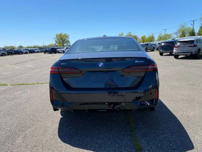 2027 BMW 5 Series — rear three-quarter view
