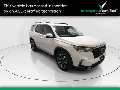 2023 Honda Pilot Touring AWD — front three-quarter view