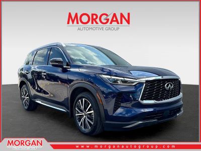 2023 INFINITI QX60 SENSORY in Grand Blue — front three-quarter view