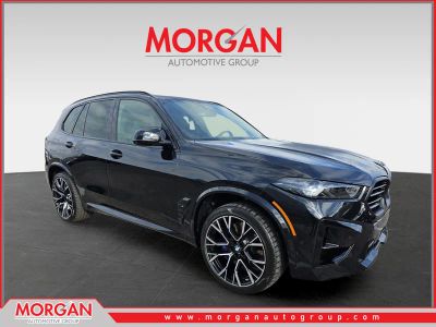 2026 BMW X5 M Competition in Black Sapphire Metallic — front three-quarter view